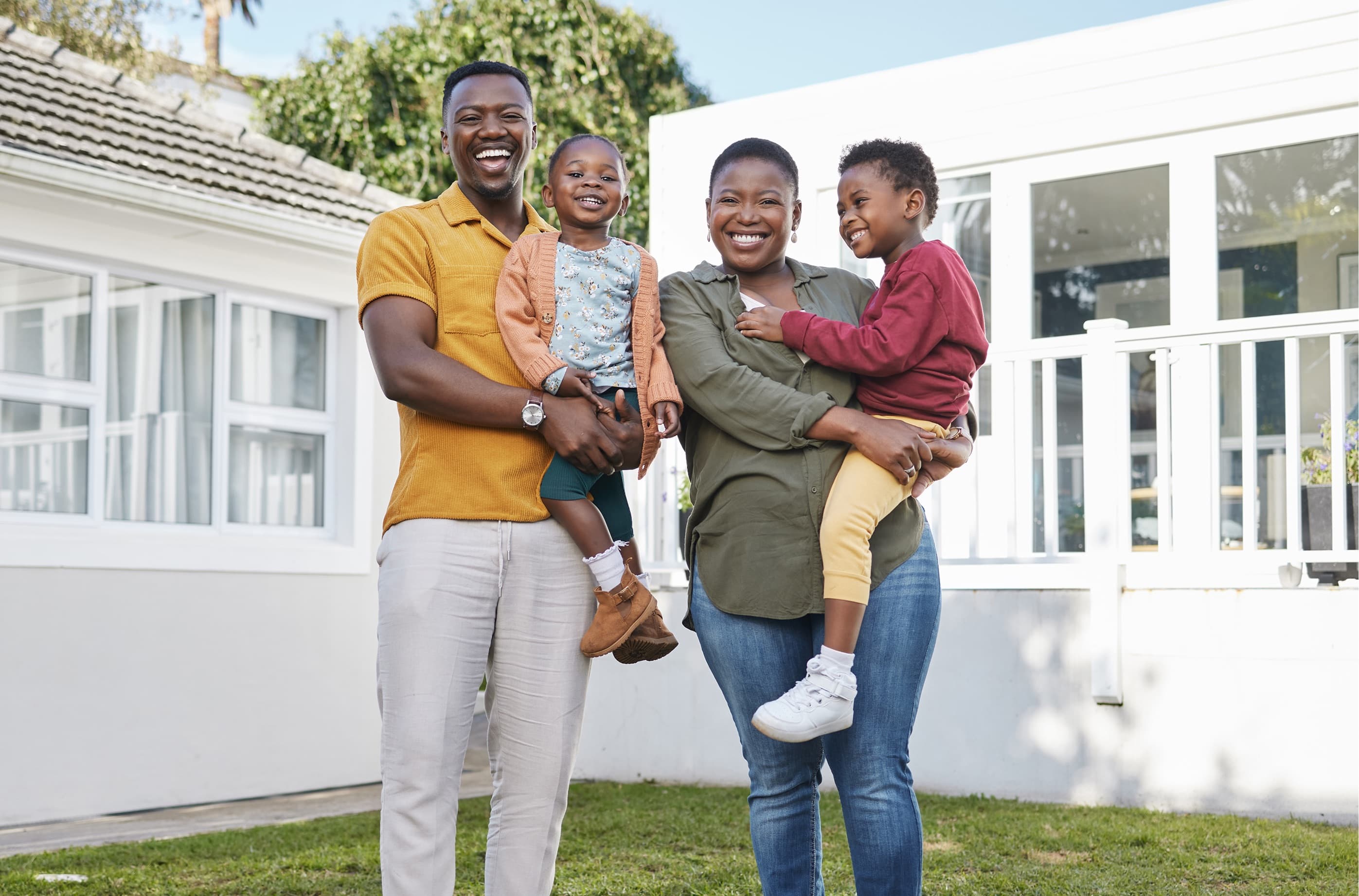 Family in front of home